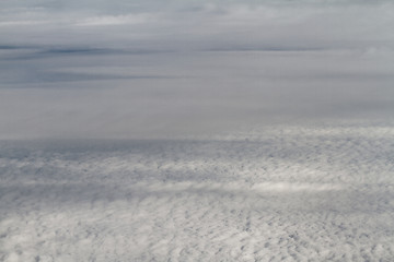 Image showing Sunrise above clouds from airplane window