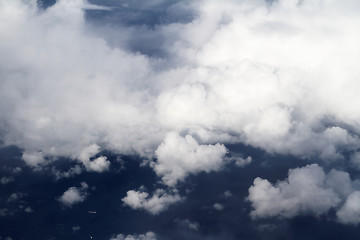 Image showing Sunrise above clouds from airplane window