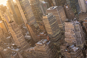 Image showing New York City skyline with urban skyscrapers at sunset, USA.