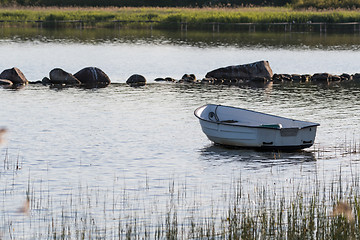 Image showing Lone row boat by the coast
