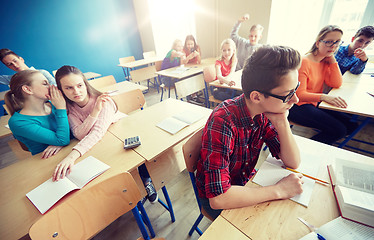 Image showing students gossiping behind classmate back at school