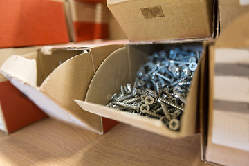 Image showing screws in cardboard boxes at workshop