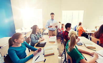 Image showing group of students and teacher with test results