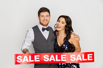 Image showing happy couple with red sale sign