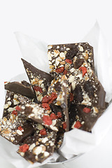 Image showing chocolate slices with berries and nuts