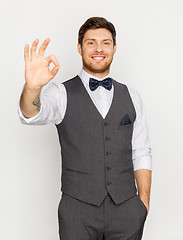 Image showing happy man in festive suit showing ok hand sign
