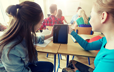 Image showing happy student girls with tablet pc at high school