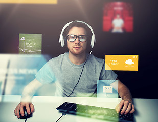 Image showing man in headset computer over virtual media screens