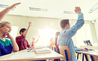 Image showing group of students with raised hands at high school