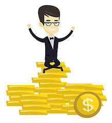 Image showing Happy business man sitting on golden coins.