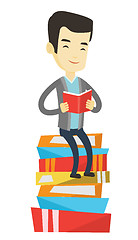 Image showing Student sitting on huge pile of books.