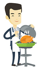 Image showing Man cooking chicken on barbecue grill.