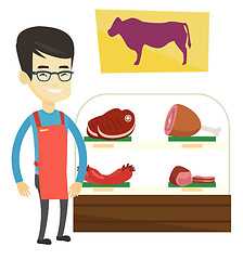 Image showing Butcher offering fresh meat in butchershop.