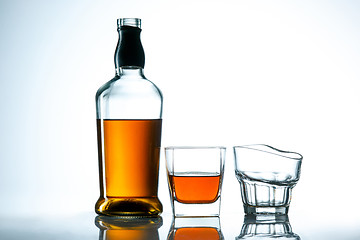 Image showing The curved glass of whiskey or alcohol drink