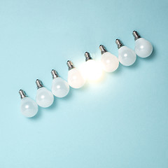 Image showing One light bulb outstanding, glowing different. Business creativity idea concepts.