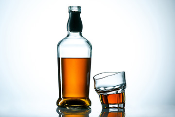 Image showing The curved glass of whiskey or alcohol drink