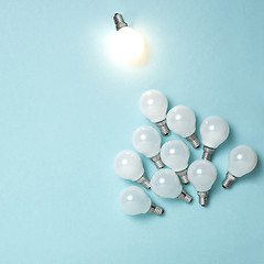 Image showing One light bulb outstanding, glowing different. Business creativity idea concepts.