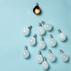 Image showing One light bulb outstanding, glowing different. Business creativity idea concepts.