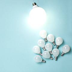 Image showing One light bulb outstanding, glowing different. Business creativity idea concepts.