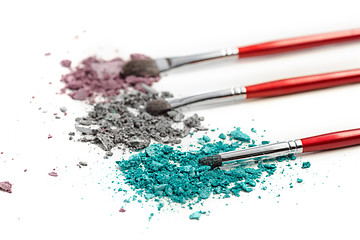 Image showing The colored eyeshadow crushed on white close up for background