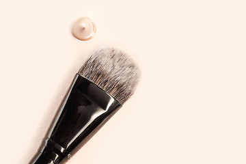 Image showing Cosmetic foundation cream and powder with brush