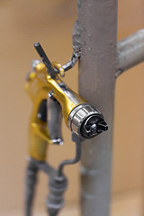 Image showing urethane finish or polish sprayer on hanger