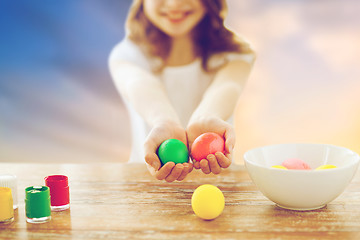 Image showing close up of girl holding colored easter eggs