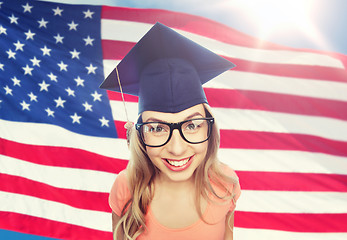 Image showing smiling young student woman in mortarboard