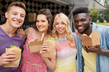 Image showing happy friends with wok and burger at food truck