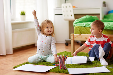 Image showing happy kids drawing at home