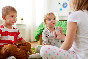 Image showing kids playing rock-paper-scissors game at home