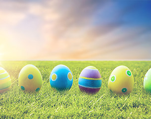 Image showing close up of colored easter eggs on grass