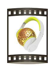 Image showing Gold Golf Ball With headphones. 3d illustration. The film strip.