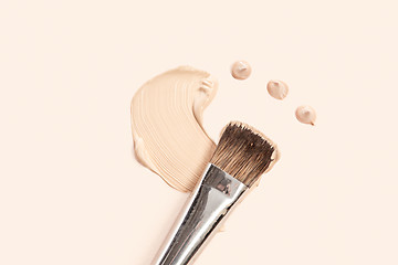 Image showing Cosmetic foundation cream and powder with brush