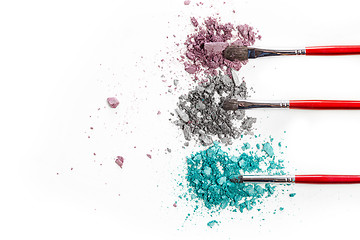 Image showing The colored eyeshadow crushed on white close up for background