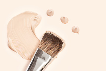 Image showing Cosmetic foundation cream and powder with brush