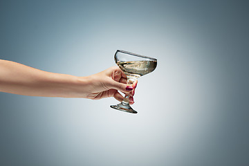 Image showing hand holding glass of wine
