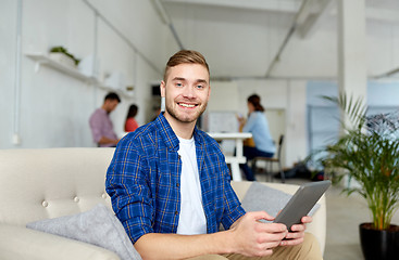 Image showing man with tablet pc working at office