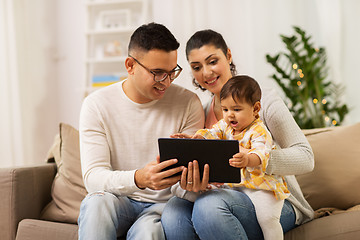 Image showing mother, father and baby with tablet pc at home