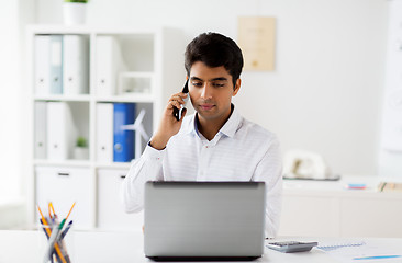 Image showing businessman calling on smartphone at office