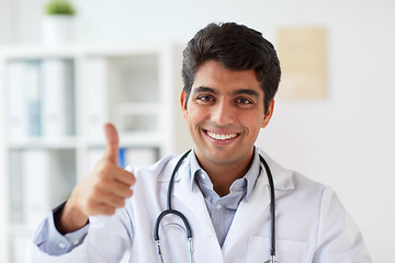 Image showing happy doctor at clinic showing thumbs up