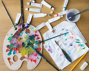 Image showing palette knife, brushes and paint tubes on table