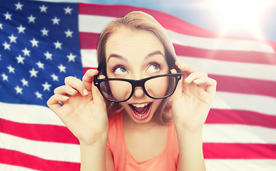 Image showing happy young woman or teenage girl in eyeglasses