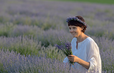 Image showing Beautiful woman holding lavender 