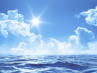 Image showing blue sky with some clouds and the sun over the ocean