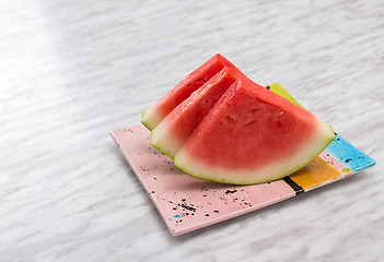 Image showing Slices of watermelon on a ceramic plate