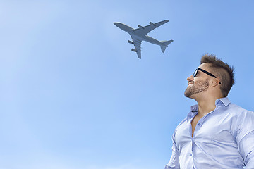 Image showing bearded man blue sky airplane