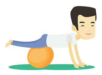 Image showing Young man exercising with fitball.