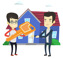 Image showing Real estate agent giving key to new house owner.