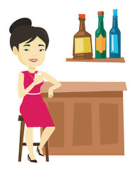 Image showing Smiling woman sitting at the bar counter.